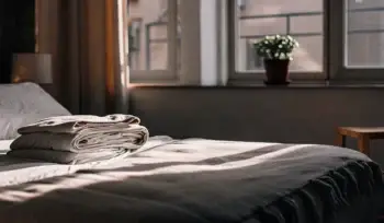 Clean comforter on bed. Massapequa Park comforter cleaning services.