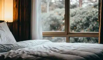 Clean comforter on a bed.