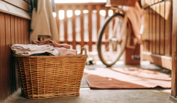 Fresh laundry delivery in Bay Shore with a basket of folded clothes.