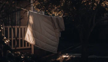Freshly cleaned comforter hanging outside to dry after professional cleaning in Bayville.