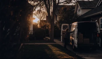A person loading laundry into a pickup service van in Bay Shore.