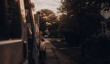 Man getting his laundry from the best pickup and delivery service in Massapequa Park.