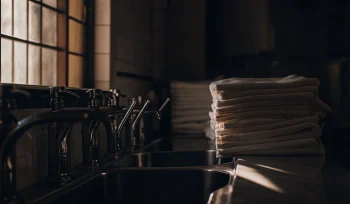 Sanitized medical laundry towels stacked in a Brookville healthcare facility.
