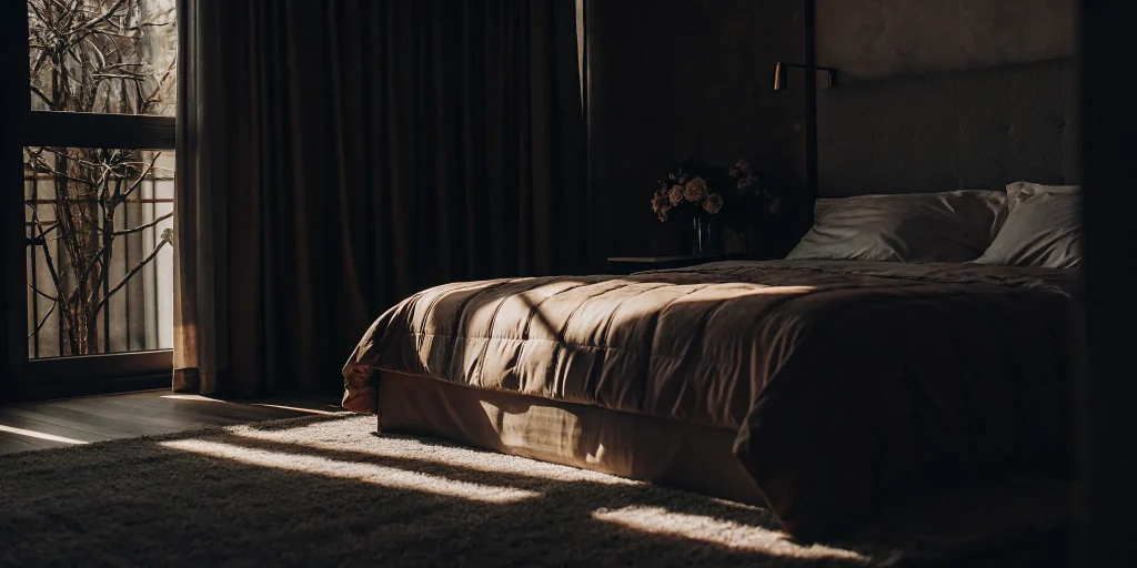 A clean comforter on a bed after professional comforter cleaning in East Hills.