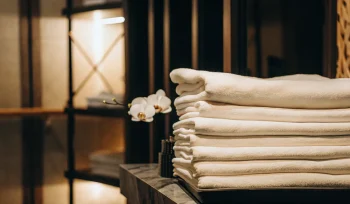 A stack of professionally cleaned healthcare linen in Carle Place.