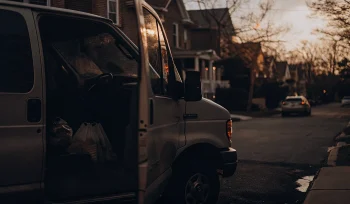 A laundry pickup service van making a stop in Rockville Centre.